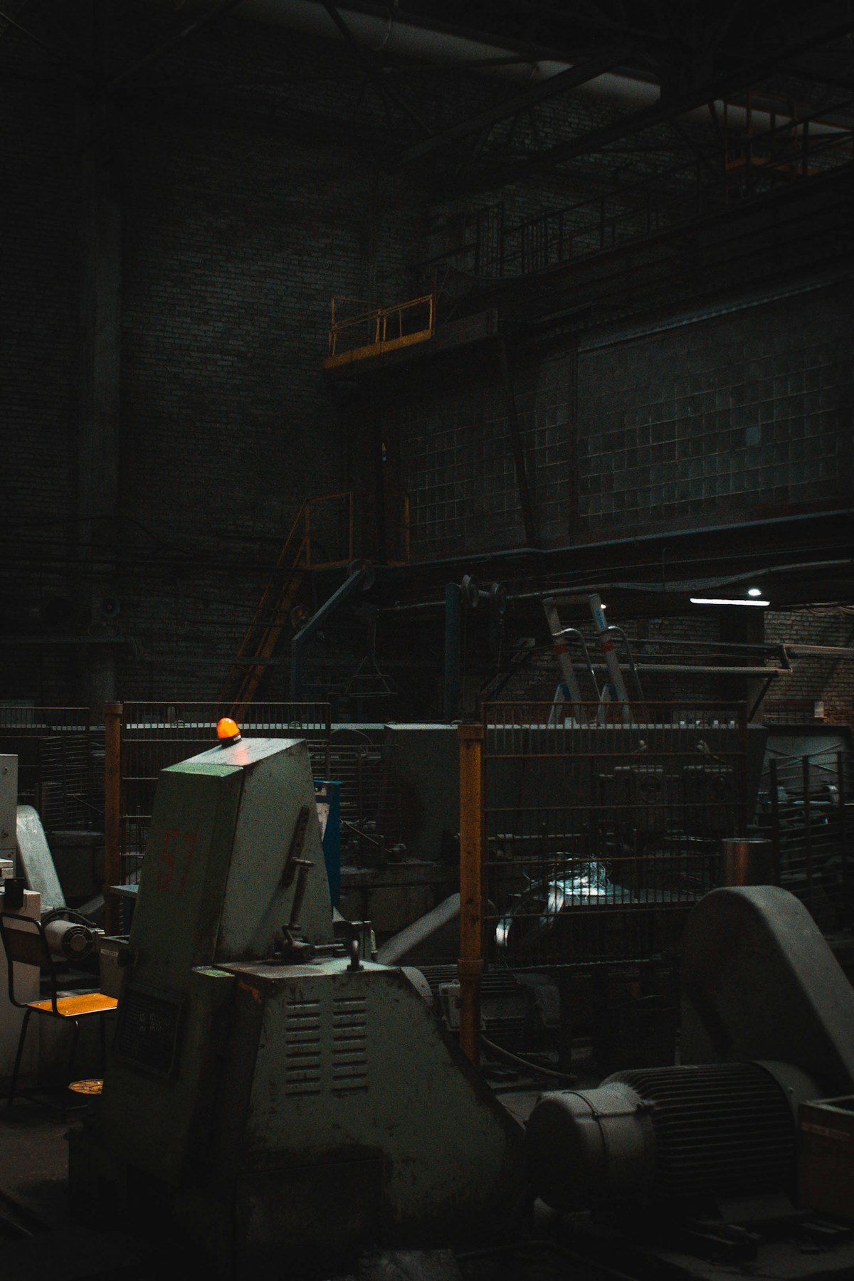 Manufacturing specialist inspecting industrial machinery